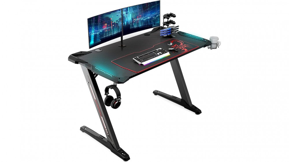 A computer sits on the EUREKA ERGONOMIC Standing Desk.