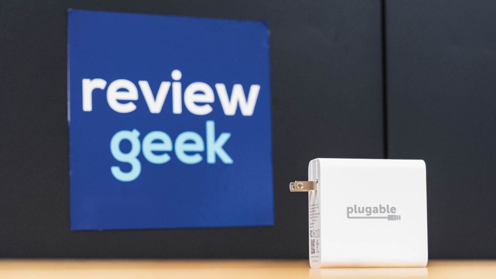 The Plugable 140W GaN Charger on a desk.